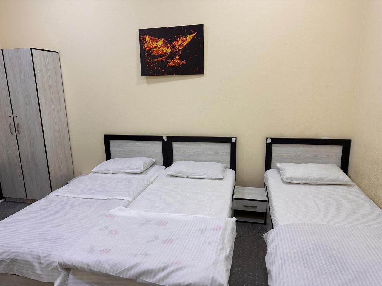 Single beds with bedside tables